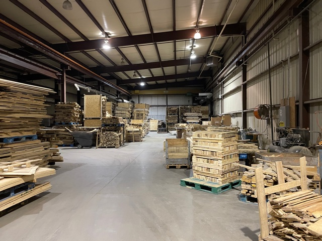 Improving Workplace Cleanliness and Order Through Professional Pallet Removal